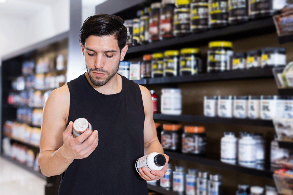 person at store buying joe rogan supplements